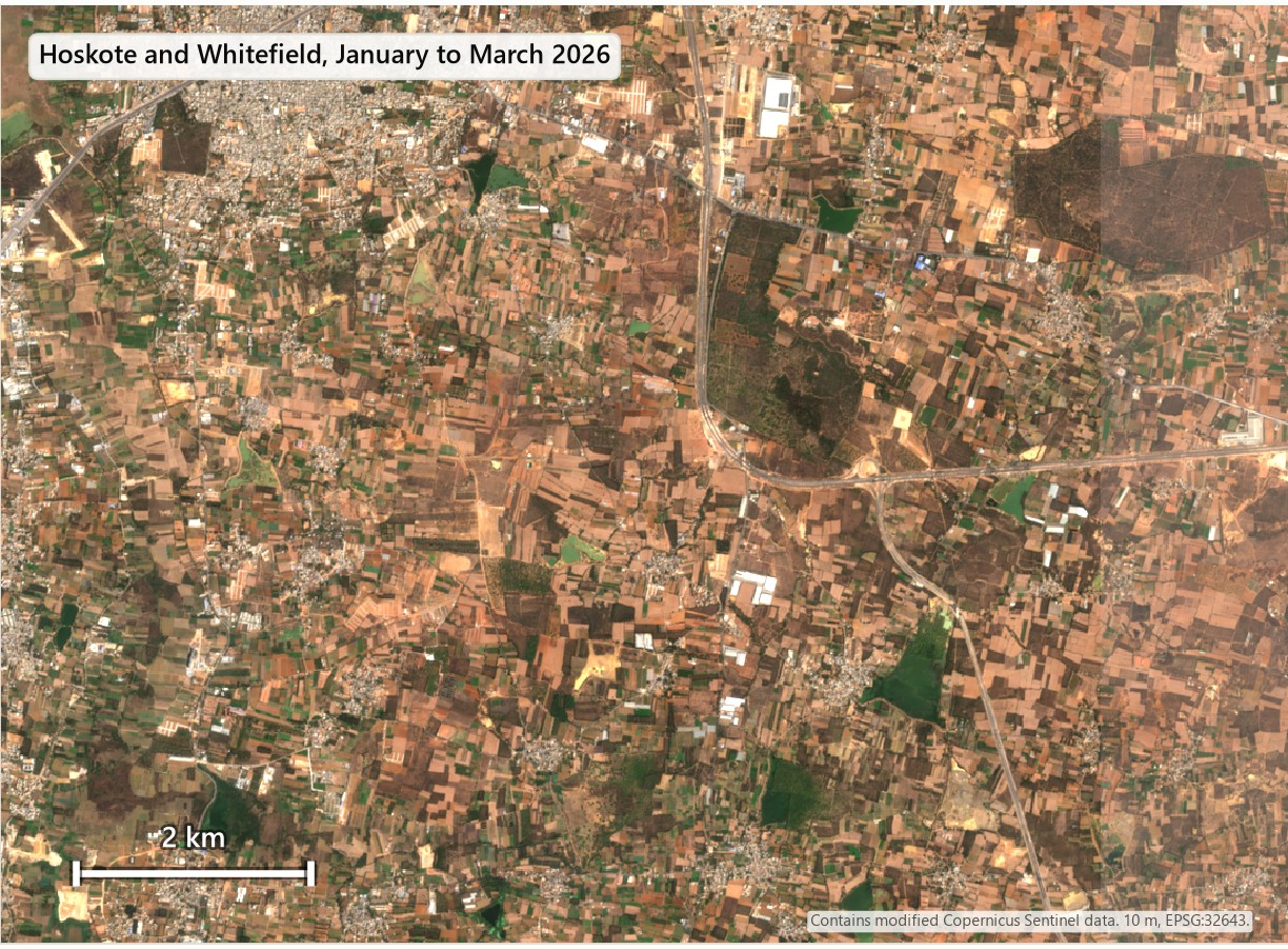 Satellite view east of Bengaluru: fields and small settlements in 2018, more grey roofs and new layouts in 2026.