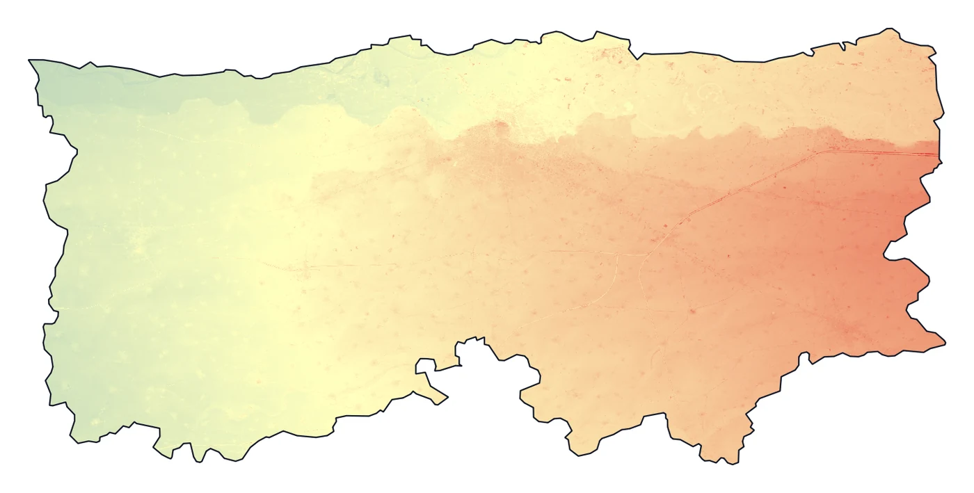 The clipped elevation raster of Ludhiana district in colour, from blue in the low west to red in the higher east, inside a black outline of the district and white outside it